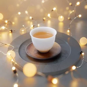 Exquisite Dehua white porcelain tea cup with traditional Chinese dragon pattern