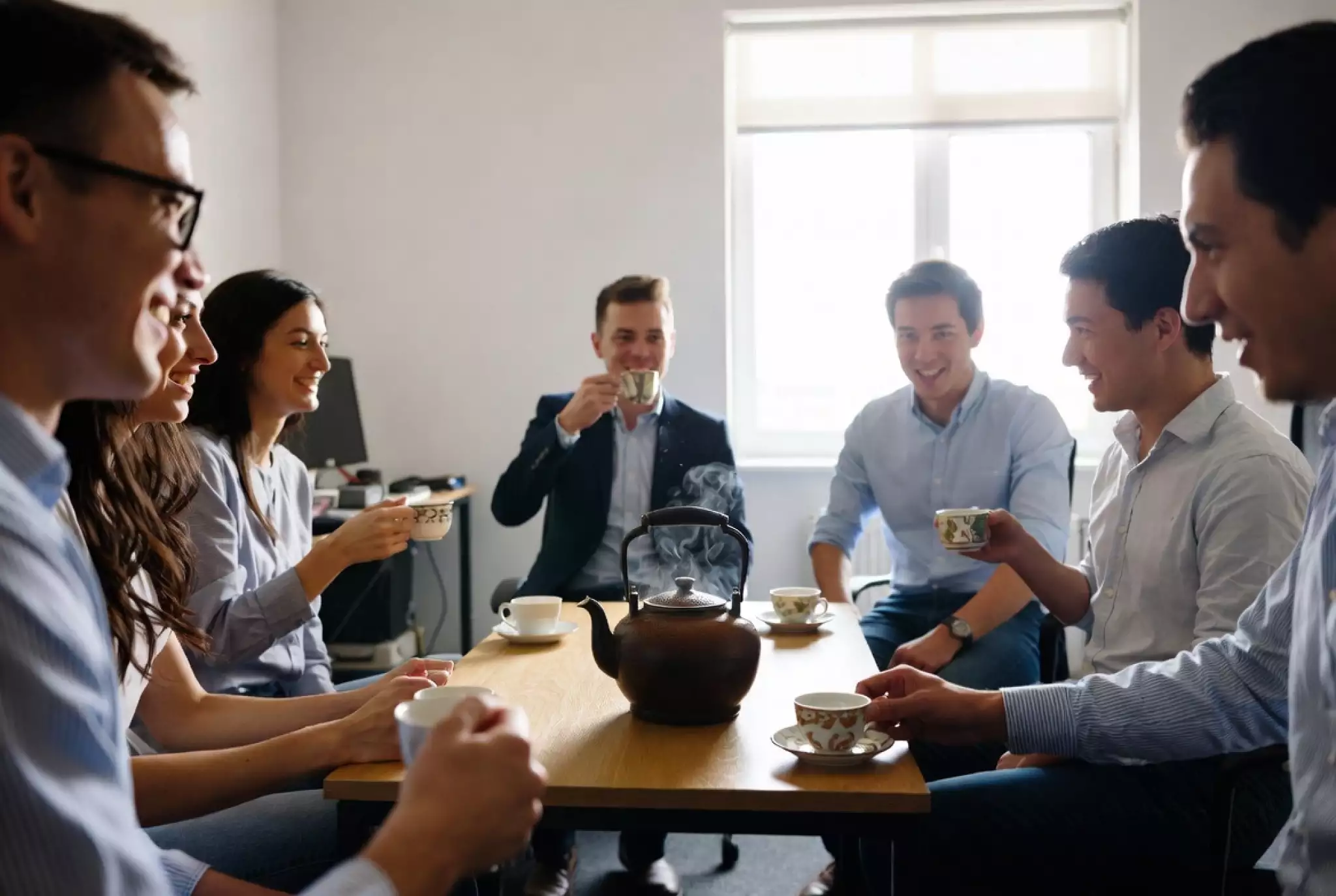 Brewing tea with small cakes in a bowl during a meeting or gathering