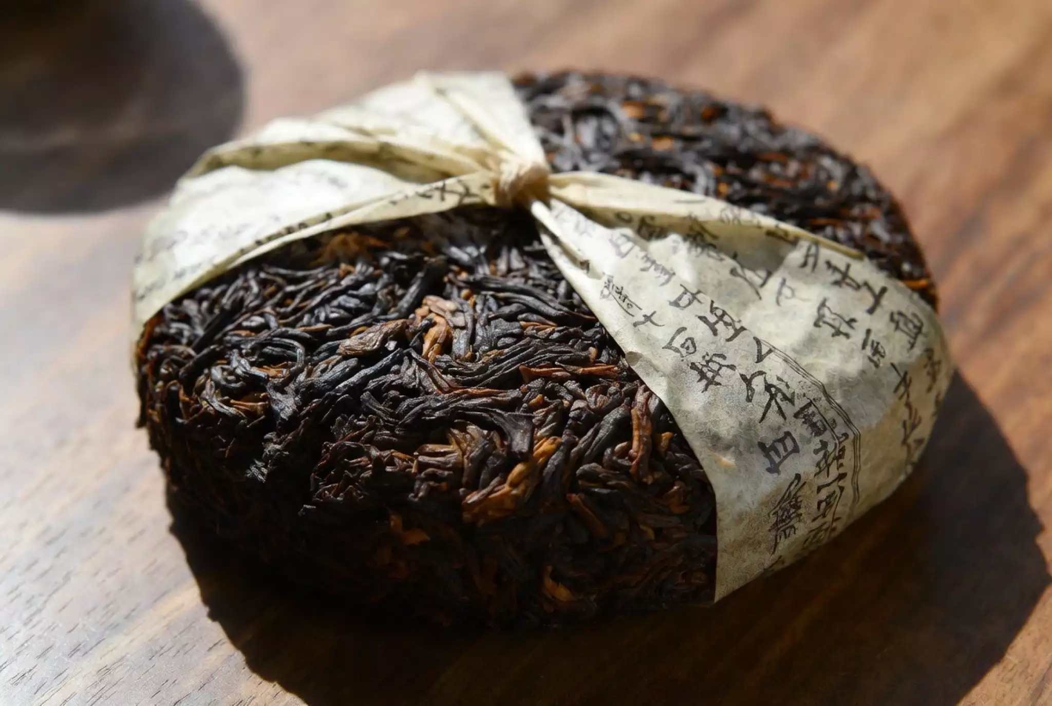 Traditional pressing of ripe Pu-erh tea into cakes in Yunnan