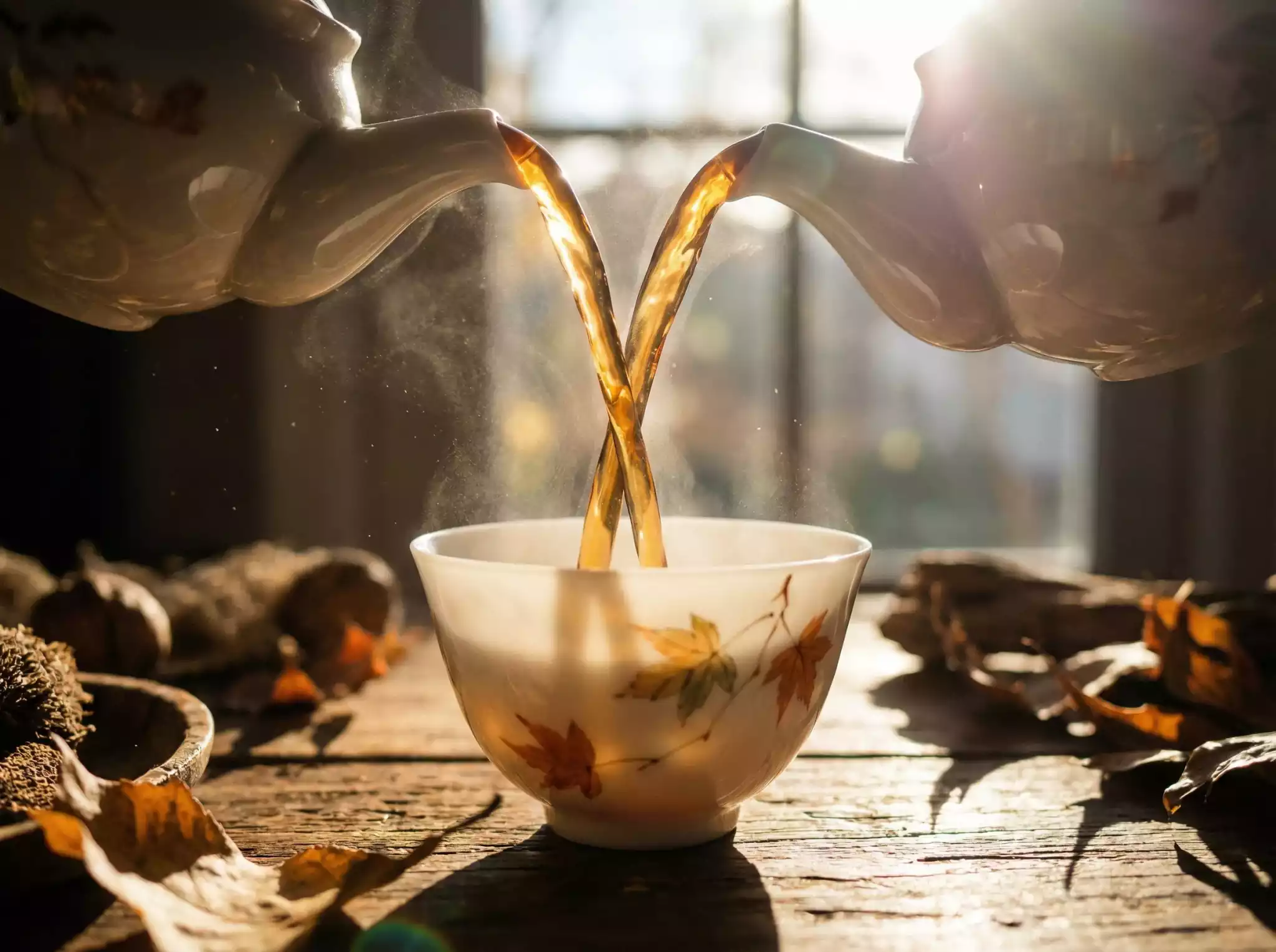 Close-up of premium black tea liquor in a clear cup with steam and warm atmospheric lighting