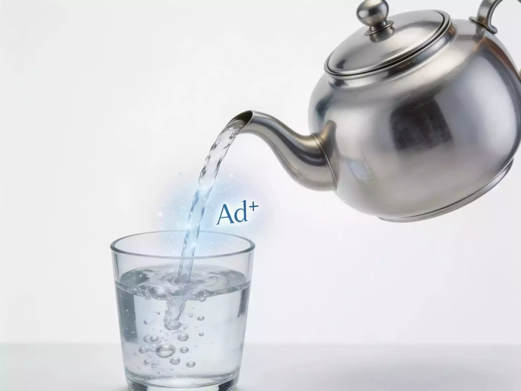 Pure silver tea kettle with artistic representation of silver ions purifying water